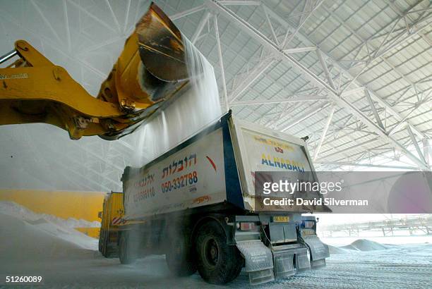 Potash is loaded into a truck at the Dead Sea Works potash recovery plant on the shores of the Dead Sea September 2, 2004 in Sodom, southern Israel....