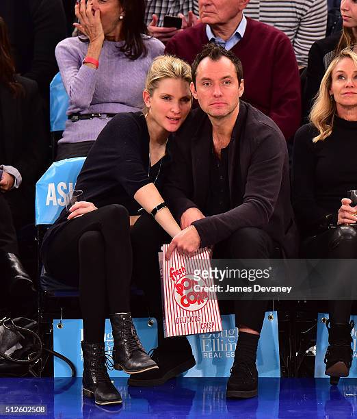 Phillipa Coan and Jude Law attend the Orlando Magic vs New York Knicks game at Madison Square Garden on February 26, 2016 in New York City.
