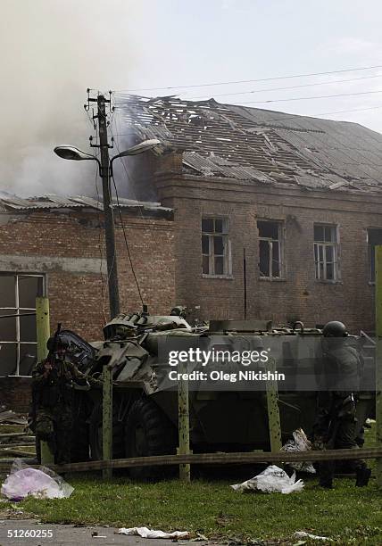 Soldier takes cover as special forces storm a school seized by Chechen separatists on September 3, 2004 in the town of Beslan, Russia. Russian...