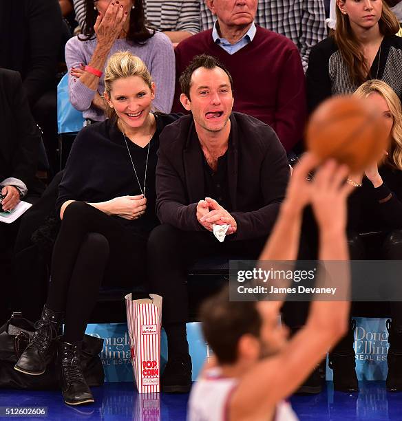 Phillipa Coan and Jude Law attend the Orlando Magic vs New York Knicks game at Madison Square Garden on February 26, 2016 in New York City.