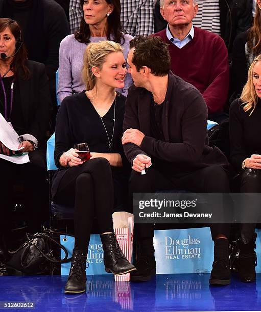 Phillipa Coan and Jude Law attend the Orlando Magic vs New York Knicks game at Madison Square Garden on February 26, 2016 in New York City.