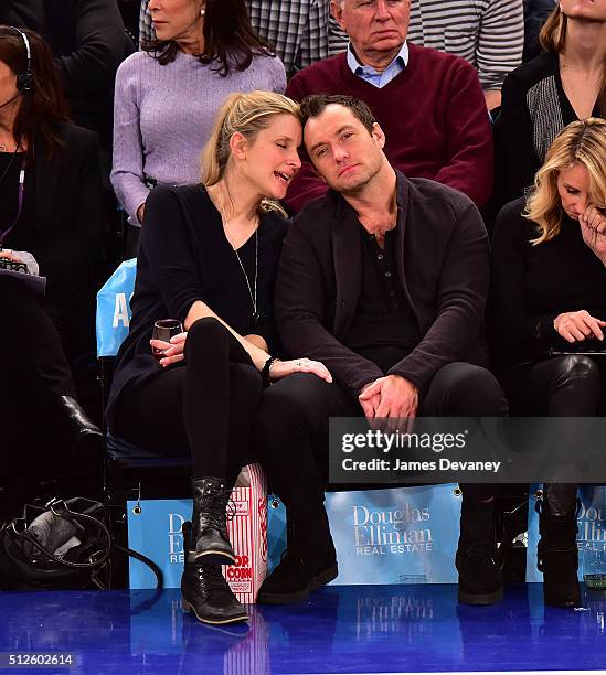 Phillipa Coan and Jude Law attend the Orlando Magic vs New York Knicks game at Madison Square Garden on February 26, 2016 in New York City.