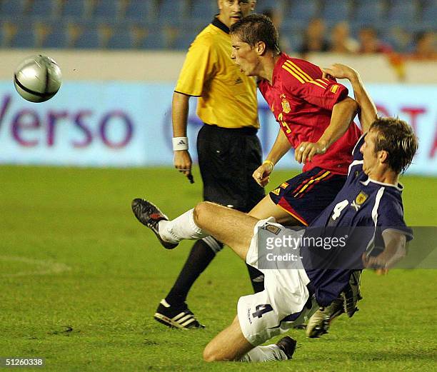 Spaniard Fernando Torres vies with Webster of Scotland during a friendly match in Ciudad de Valencia Stadium in Valencia 03 September 2004.