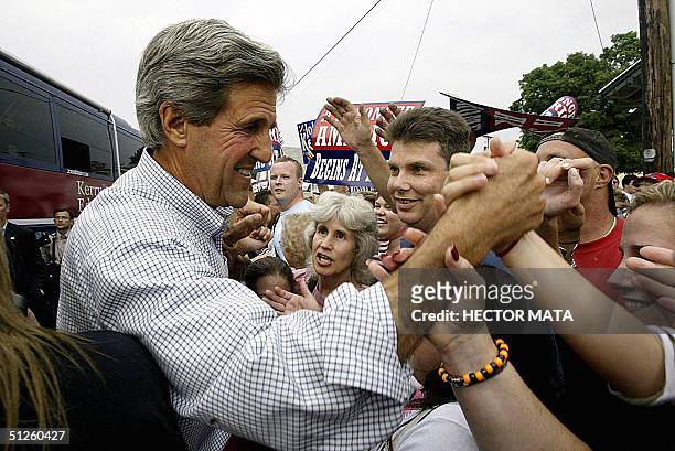 Democratic presidential candidate John Kerry shake hands with supporters at a campaign stop in Mount Vernon, Ohio, 03 September, 2004. Kerry's...