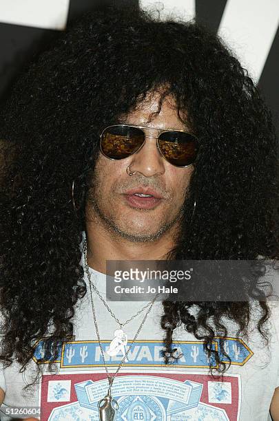 Slash of Velvet Revolver signs copies of their first album "Contraband" at the Piccadilly Virgin Megastore on September 3, 2004 in London.