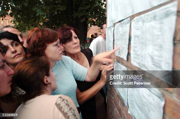 Russian woman view a list outside a hospital September 3, 2004 in Beslan, Russia. More than 200 people were reportedly killed and at least 700...