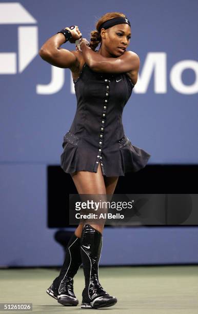 Serena Williams warms up prior to her match against Tatiana Golovin of France during the US Open at the USTA National Tennis Center in Flushing...