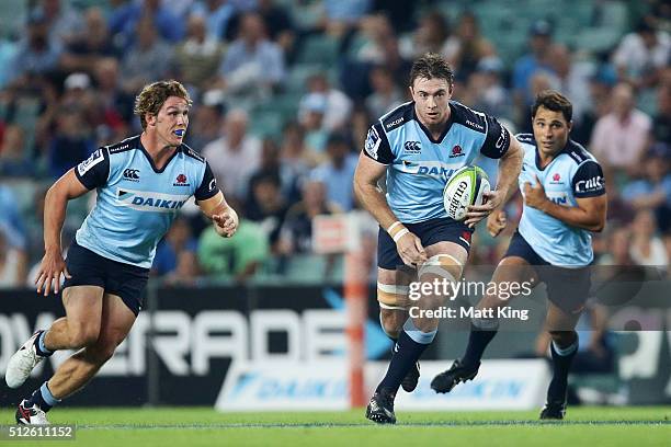 Jed Holloway of the Waratahs makes a break during the round one Super Rugby match between the Waratahs and the Reds at Allianz Stadium on February...