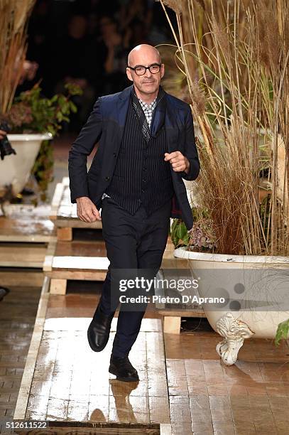 Designer Antonio Marras acknowledges the applause of the public after the Antonio Marras show during Milan Fashion Week Fall/Winter 2016/17 on...