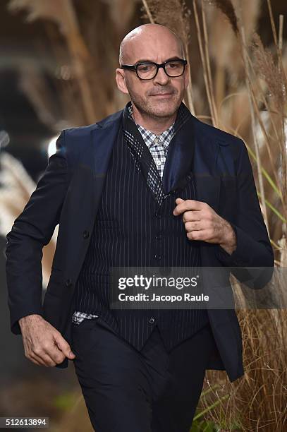 Designer Antonio Marras aknowledge the applause of the public after the Antonio Marras show during Milan Fashion Week Fall/Winter 2016/17 on February...