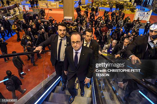 French President Francois Hollande visits the 50th International Agriculture Fair of Paris at the Porte de Versailles exhibition center in Paris, on...