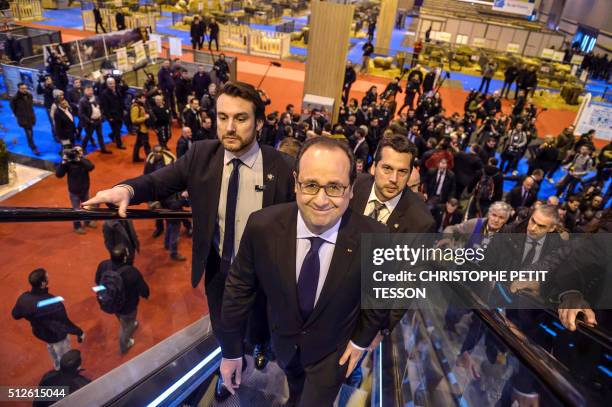 French President Francois Hollande visits the 50th International Agriculture Fair of Paris at the Porte de Versailles exhibition center in Paris, on...