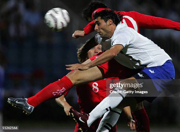 James Collins of Wales jumps with Mahir Shukvrov of Azerbaijan to head the ball during the FIFA World Cup Group Six Qualifying match played at the...