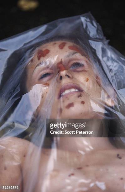 The body of a dead woman, one of 330 known dead, lies in the city mortuary the day after the three-day Russian school siege in Beslan, in which...