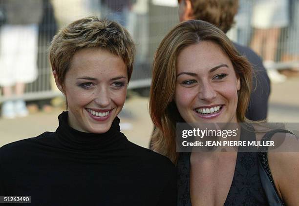 French actress Helene de Fougerolles and Sylvie Bousquet arrive for the preview of Steven Spielberg's new film 'The Terminal' at the 30th Deauville...