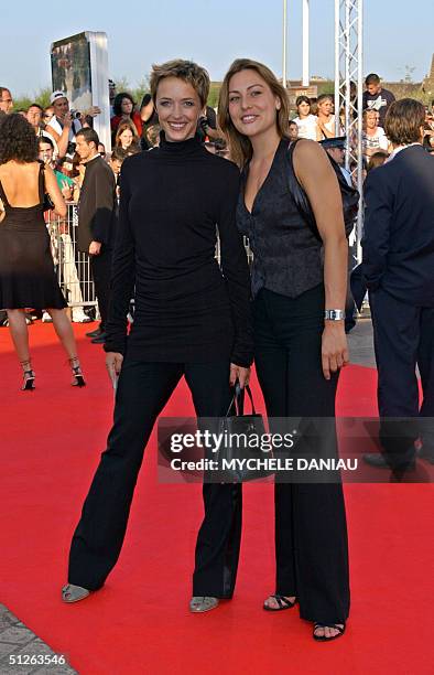 French actress Helene de Fougerolles and Sylvie Bousquet arrive for the preview of Steven Spielberg's new film 'The Terminal' at the 30th Deauville...