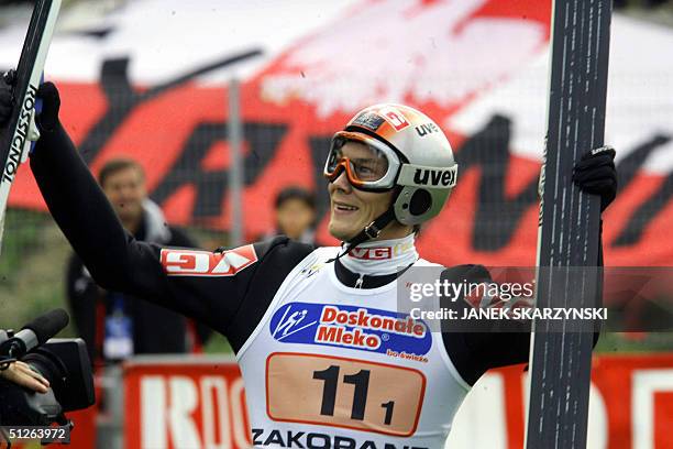 Daniel Forfang from Norwegian team enjoys after his 139.5 meter-long jump, summer ski-jump in Zakopane record, during FIS Grand Prix Ski-jumping Team...