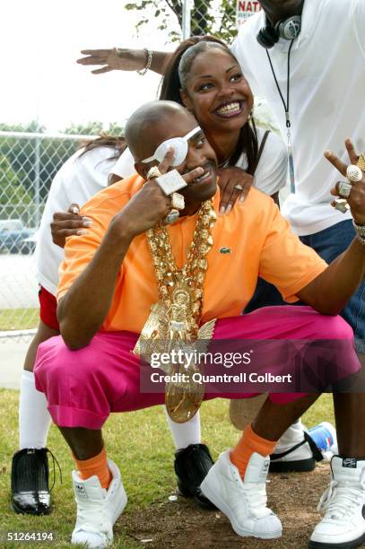 Rapper Slick Rick poses with loyal fan, Niki Brown, during SoulFest Atlanta 2004 at The Green Lot at Turner Field September 4, 2004 in Atlanta,...