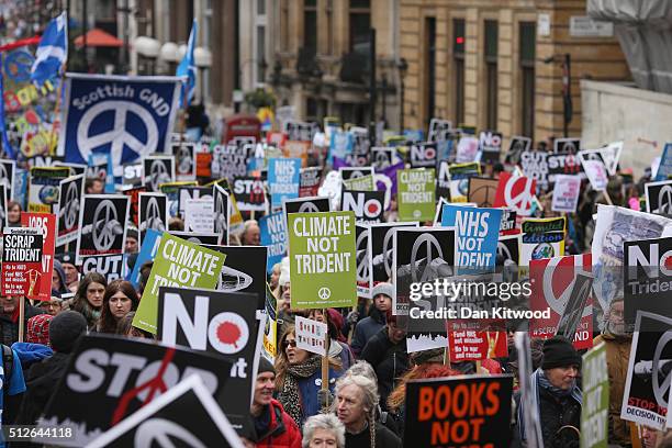 Demonstrators march during a 'Stop Trident' march though central London on February 27, 2016 in London, England. The leaders of three political...