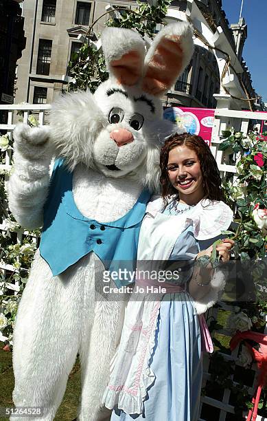 Alice in Wonderland is seen and the March Hare at the Mad Hatters Tea Party at the Regent Street Festival in central London on September 5, 2004 in...