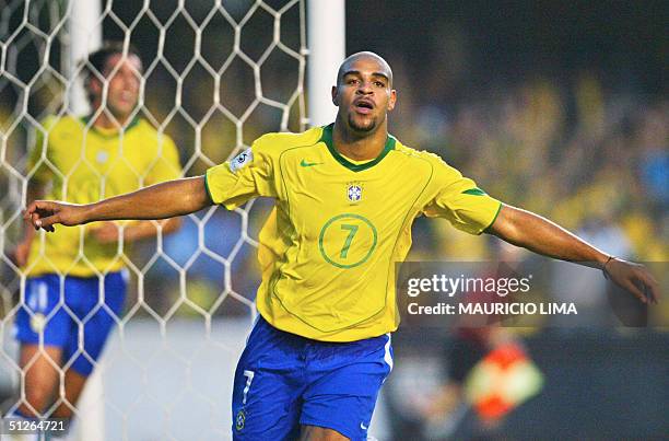 Brazilian player Adriano celebrates his goal against Bolivia at the Morumbi stadium in Sao Paulo, 05 September 2004, for the FIFA World Cup Germany...