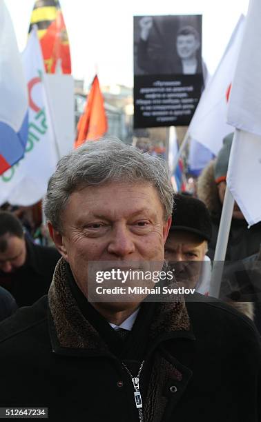 Russian opposition Yabloko party leader Grigory Yavlinsky attends a mass march marking the one-year anniversary of the killing of opposition leader...