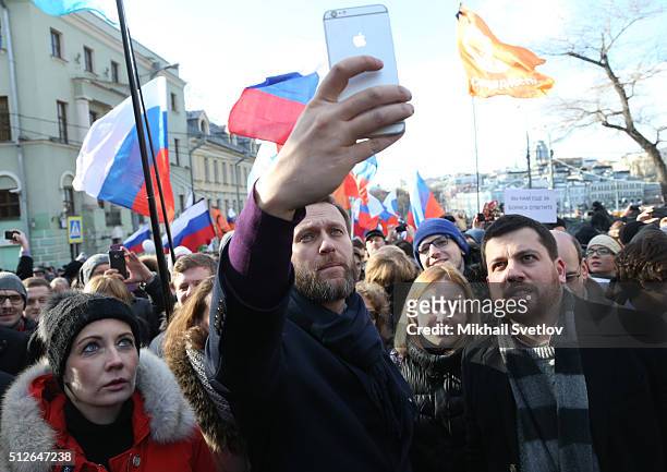 Russian opposition leader Alexei Navalny , his spouse Yulia Navalnaya and his aide Leonid Volkov attend a mass march marking the one-year anniversary...