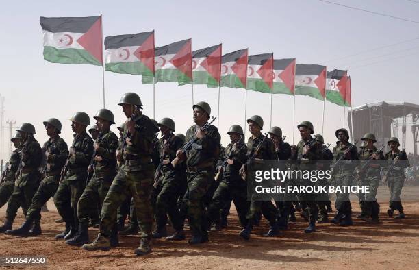 Members of the Sahrawi People's Liberation Army parade with Polisario Front's flags during a ceremony to mark 40 years after the Front proclaimed the...