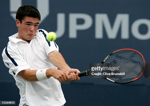 Jamie Baker of Great Britian returns to Igor Sijsling of the Netherlands during the US Open at the USTA National Tennis Center in Flushing Meadows...