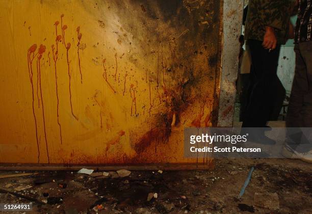 The blood of a female "shahid" suicide bomber remains painted on a wall near the corner where the Chechen militant blew herself up in the ruins of...