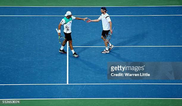 Simone Bolelli and Andreas Seppi of Italy in action against Feliciano Lopez and Marc Lopez of Spain in the men's doubles final of the ATP Dubai Duty...