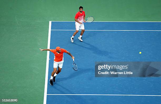 Feliciano Lopez and Marc Lopez of Spain in action against Simone Bolelli and Andreas Seppi of Italy in the men's doubles final of the ATP Dubai Duty...
