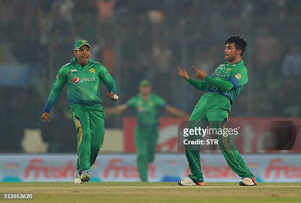Pakistan cricketer Mohammad Amir successfully appeals for a Leg Before Wicket decision against Indian cricketer Suresh Raina during the match between...