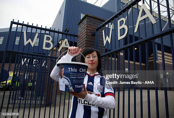 Charity collectors with Chris Brunt of West Bromwich Albion branded buckets - fans are collecting today to show support to Brunt after the coin...