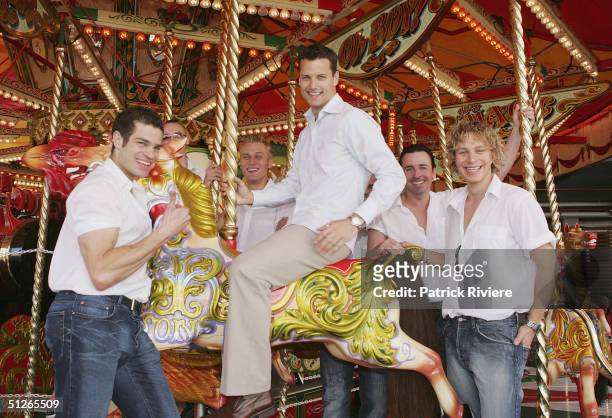 Bachelor Boy James Getzlaff gets a ride on sa merry-go-round at a media call during his visit looking for Mr Right for the new reality show"Boy Meets...