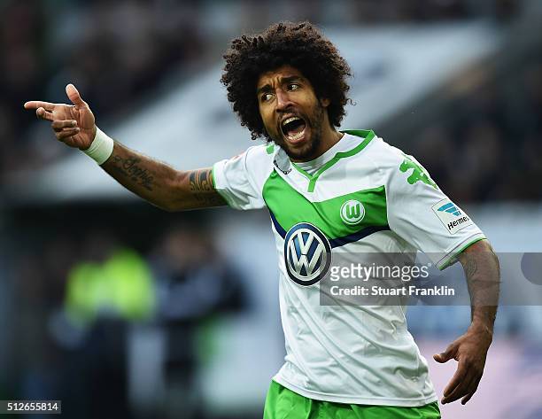 Dante of Wolfsburg reacts during the Bundesliga match between VfL Wolfsburg and FC Bayern Muenchen at Volkswagen Arena on February 27, 2016 in...