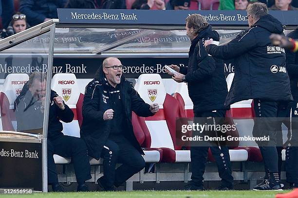 Head coach Thomas Schaaf of Hannover 96 celebrates with team after the Bundesliga match between VfB Stuttgart and Hannover 96 at Mercedes-Benz Arena...