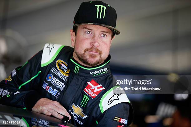 Kurt Busch, driver of the Monster Energy/Haas Automation Chevrolet, looks on from the garage area during practice for the NASCAR Sprint Cup Series...