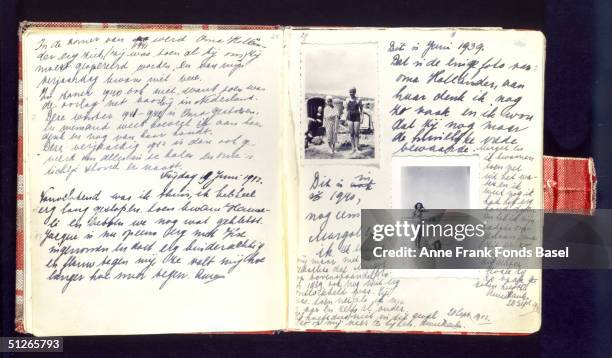 Handwritten page of Anne Frank's diary which she kept during her wartime confinement, it includes photographs of her on the beach during a holiday...