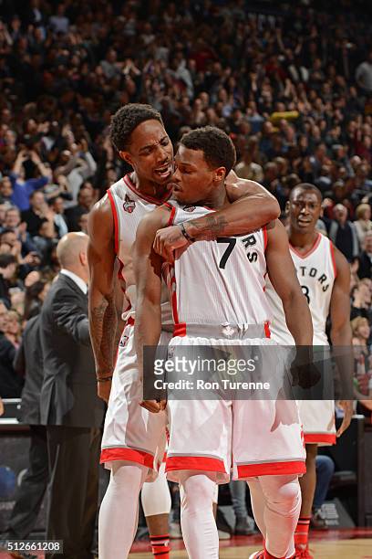 DeMar DeRozan and Kyle Lowry of the Toronto Raptors celebrate after beating the Cleveland Cavaliers on February 26, 2016 at Air Canada Centre in...