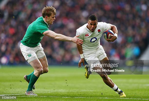 Anthony Watson of England takes on Andrew Trimble of Ireland during the RBS Six Nations match between England and Ireland at Twickenham Stadium on...