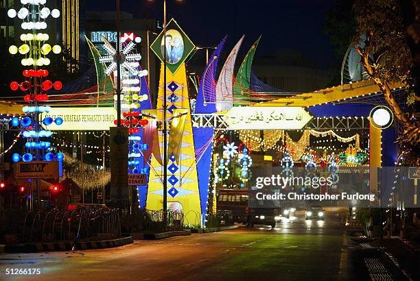 One of the many illuminated and colourful wedding arches that adorn the city in preparation for the royal procession, September 6 Bandar Seri...