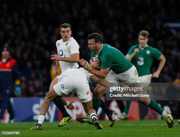 Robbie Henshaw of Ireland is tackled by Jack Nowell of England during the RBS Six Nations match between England and Ireland, at Twickenham Stadium on...
