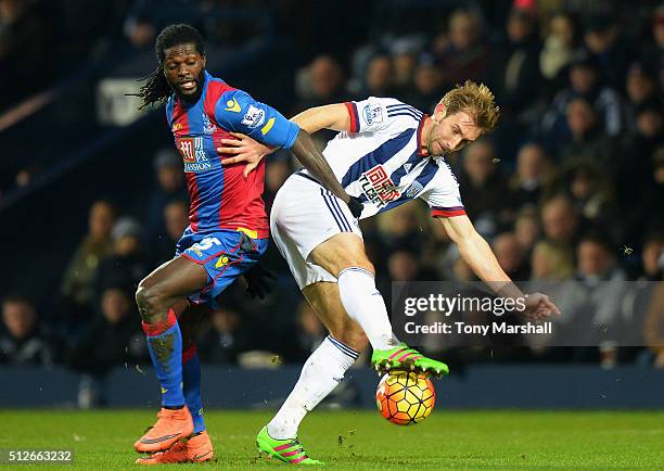 Craig Dawson of West Bromwich Albion and Emmanuel Adebayor of Crystal Palace compete for the ball during the Barclays Premier League match between...