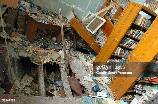 Hole is seen in the floor of a library inside a school September 6, 2004 in Beslan, southern Russia. More than 350 people died after Chechen militant...