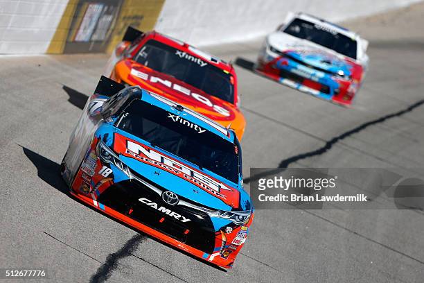 Kyle Busch, driver of the NOS Energy Drink Toyota, leads Kyle Larson, driver of the ENEOS Chevrolet, during the NASCAR XFINITY Series Heads Up...