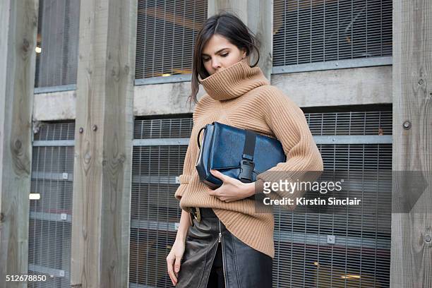 Fashion bogger Doina Ciobanu wears By Dimitri skirt, Paul Smith sweater and a Christopher Kane bag on day 4 during London Fashion Week Autumn/Winter...