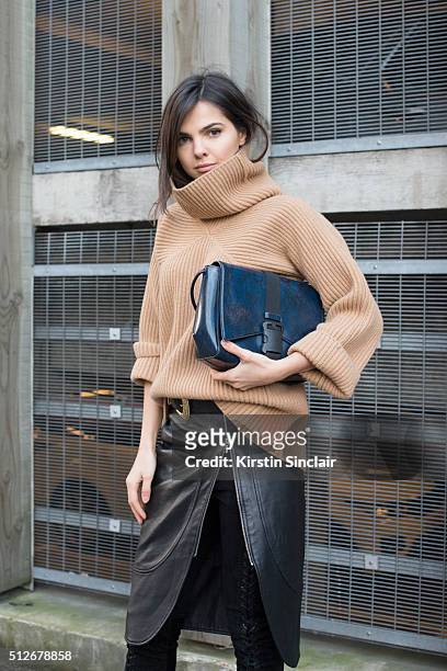 Fashion bogger Doina Ciobanu wears By Dimitri skirt and trousers, Paul Smith sweater and Christopher Kane bag on day 4 during London Fashion Week...
