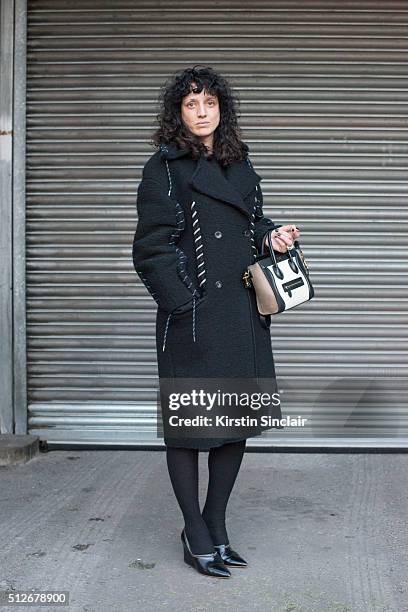 Fashion stylist agent Sofie Geradin wears an Acne Studios coat and shoes, and Celine bag on day 4 during London Fashion Week Autumn/Winter 2016/17 on...