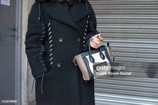 Fashion stylist agent Sofie Geradin wears an Acne Studios coat and Celine bag on day 4 during London Fashion Week Autumn/Winter 2016/17 on February...